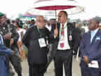 Airport Manager, Marco Fenini, and Captain Williams monitor proceedings at the reception ceremony for the president at Ibom International Airport where the president and commander-in-chief of the armed forces, His Excellency Dr. Goodluck Jonathan, is expe